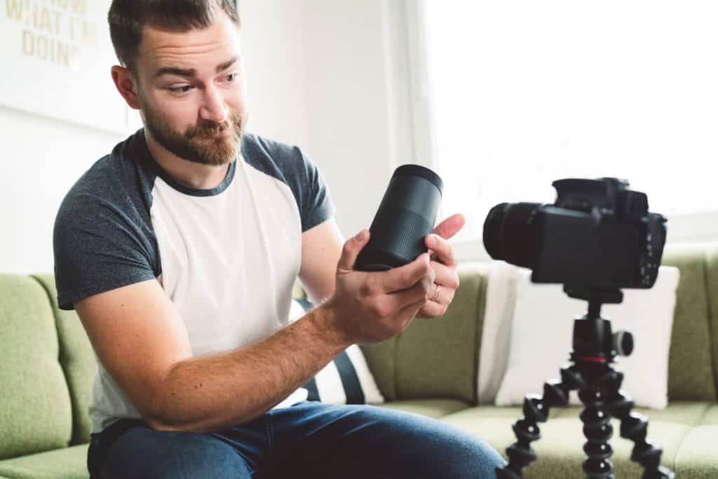 man recording product review for youtube