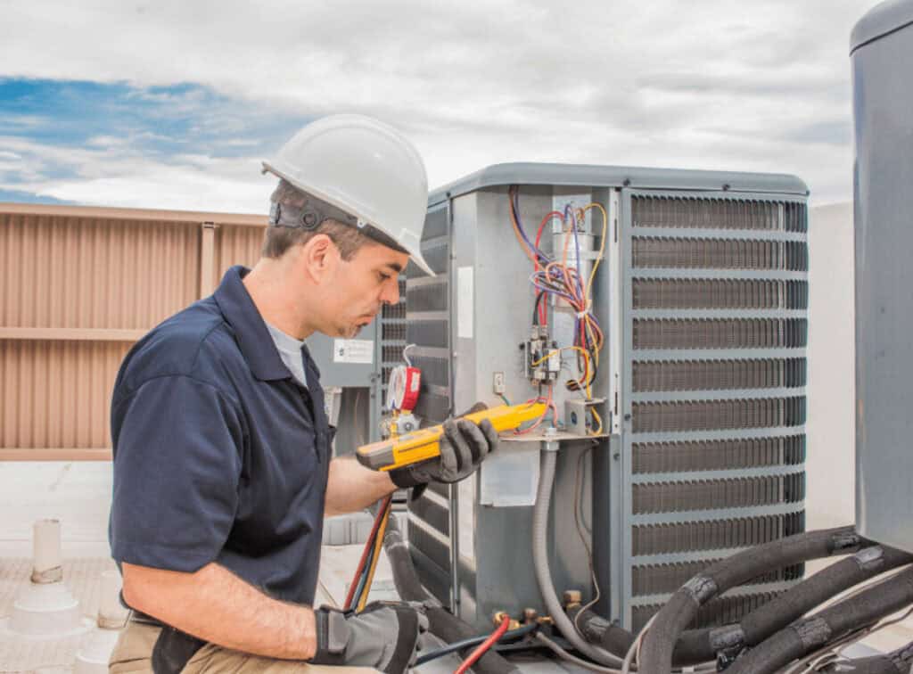 Technician Fixing a Common HVAC Issue