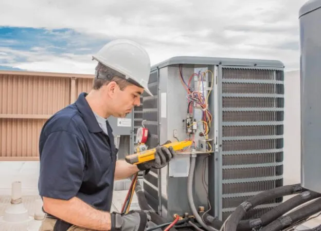 Technician Fixing a Common HVAC Issue