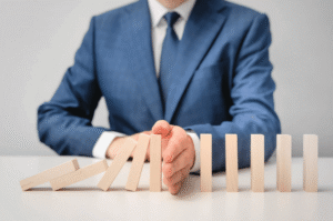 Man in suit contemplating domino strategy