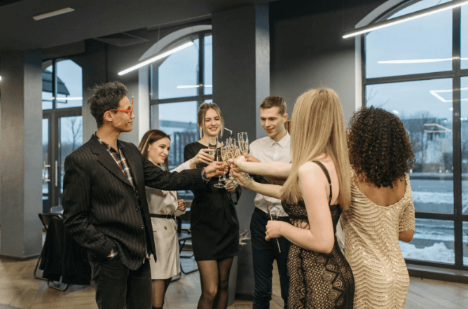 Business event attendees holding wine glasses