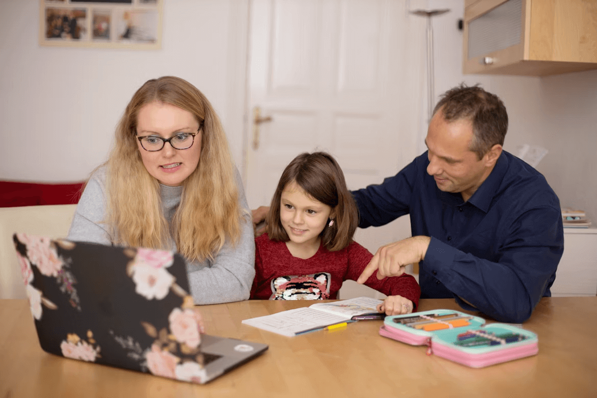 Family using laptop for online high school