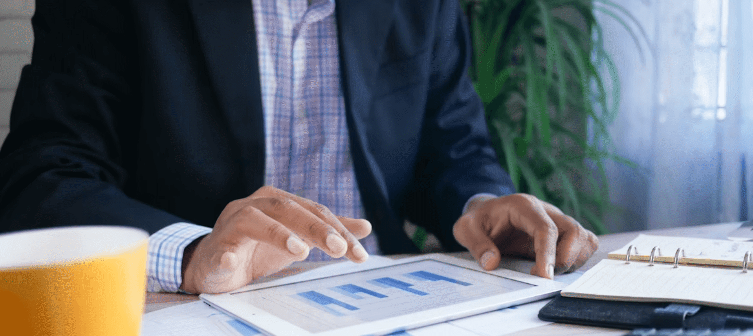 Entrepreneur analyzing business financing on a tablet with