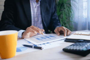 Entrepreneur analyzing business financing on a tablet with