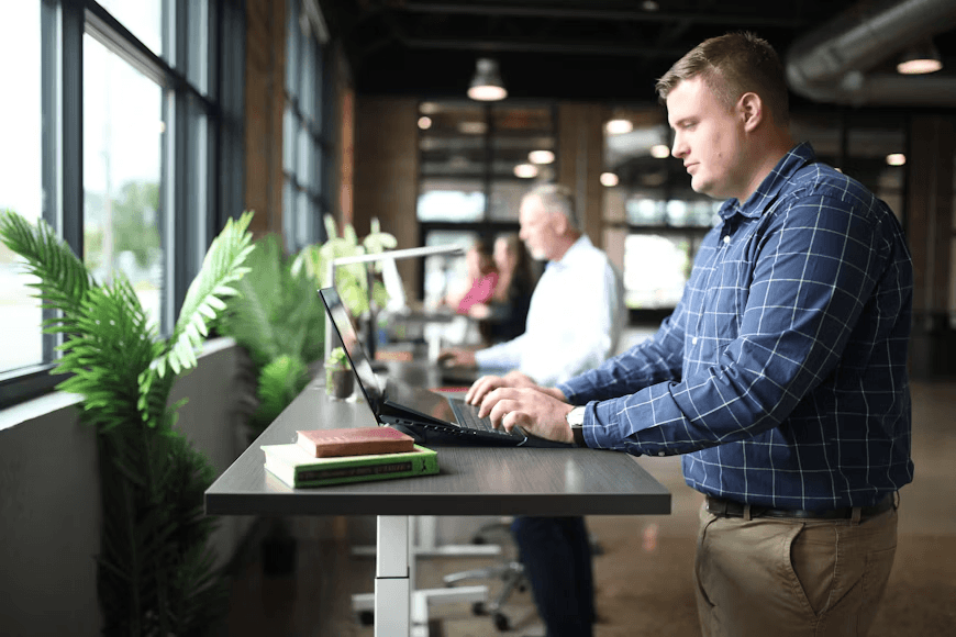 Man using laptop for real estate cost